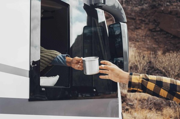 How to plan a camping trip that includes visits to UK distilleries and breweries?